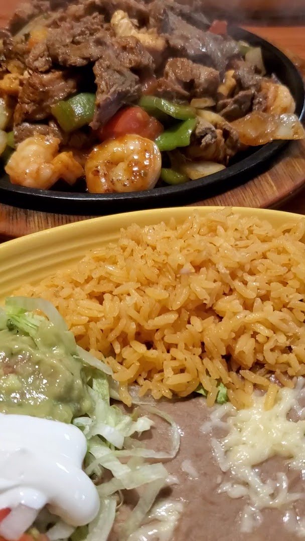 Plates of fajitas and salads.