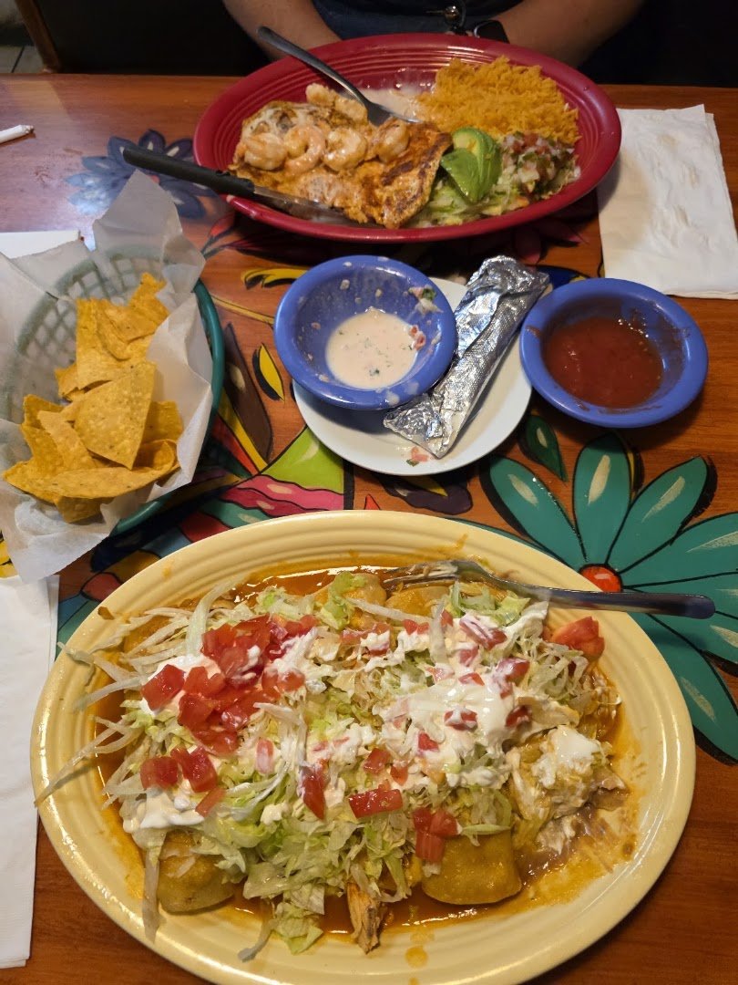 Plates of fajitas and salads.